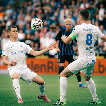 Genk's Konstantinos Kos Karetsas and Genk's Bryan Heynen pictured in action during a soccer match between Club Brugge and KRC Genk, Sunday 27 July 2025 in Brugge, on day 1 of the 2025-2026 'Jupiler Pro League' first division of the Belgian championship. BELGA PHOTO KURT DESPLENTER