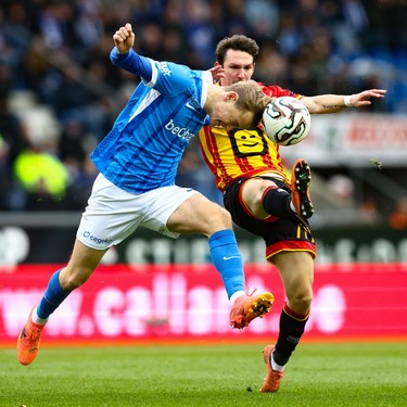 Genk's Matte Smets and Mechelen's Benito Raman fight for the ball during a soccer match between KRC Genk and KV Mechelen, Sunday 23 November 2025 in Genk, a game of day 15 of the 2025-2026 'Jupiler Pro League' first division of the Belgian championship. BELGA PHOTO BRUNO FAHY
