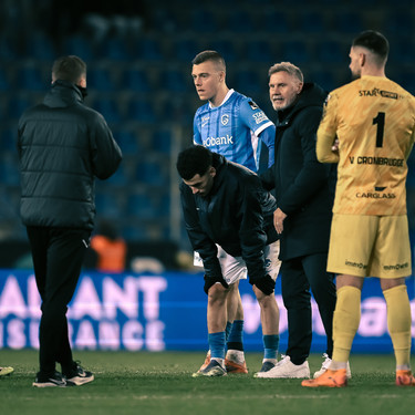 Genk's Daan Heymans, Genk's Zakaria El Ouahdi and Genk's head coach Thorsten Fink look dejected after losing a soccer game between KRC Genk and RSC Anderlecht, in the 1/8 final of the Croky Cup Belgian cup, Thursday 04 December 2025 in Genk. BELGA PHOTO JOHAN EYCKENS