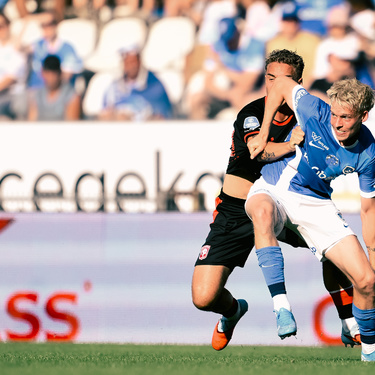 Twente's Aske Adelgaard and Genk's Jeppe Erenbjerg fight for the ball during a friendly soccer game between Racing Genk vs FC Twente, on Sunday 02 August 2026 in Genk, in preparation of the upcoming 2026-2027 Belgian first division soccer season. BELGA PHOTO JOHAN EYCKENS